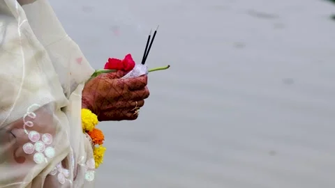 Devotee Offering Incense And Red Flower During chhath puja Traditional Hind.. Stock Footage 340889927