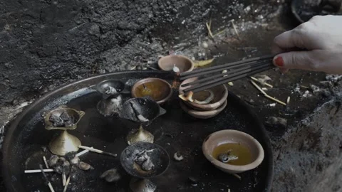 Devotee offering the incense sticks at temple at day Stock Footage 264028500