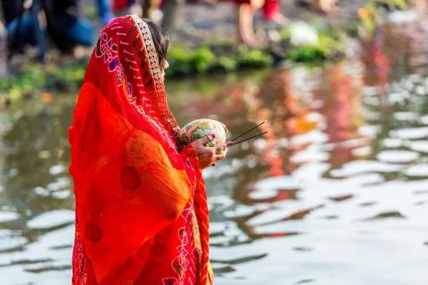 Devotee offering prayers to God During Chhath Puja Festival Stock Photos