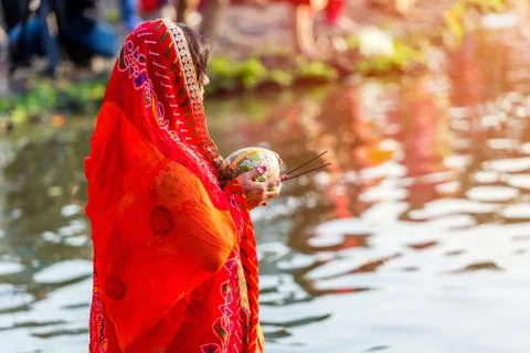 Devotee offering prayers to God During Chhath Puja Festival Stock Photos