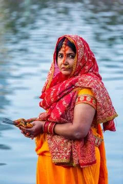 Devotee offering prayers to God During Chhath Puja Festival Stock Photos