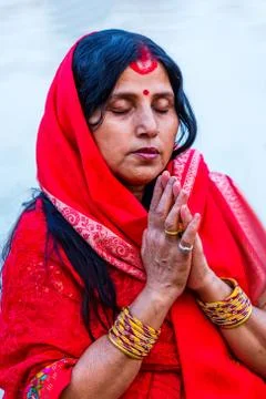 Devotee offering prayers to God During Chhath Puja Festival Stock Photos