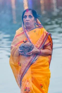 Devotee offering prayers to God During Chhath Puja Festival Stock Photos