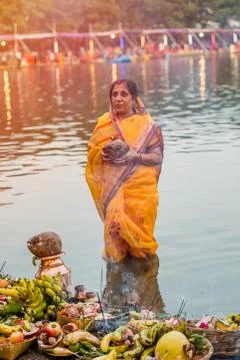 Devotee offering prayers to God During Chhath Puja Festival Stock Photos