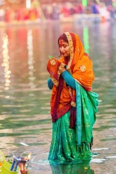 Devotee offering prayers to God During Chhath Puja Festival Stock Photos