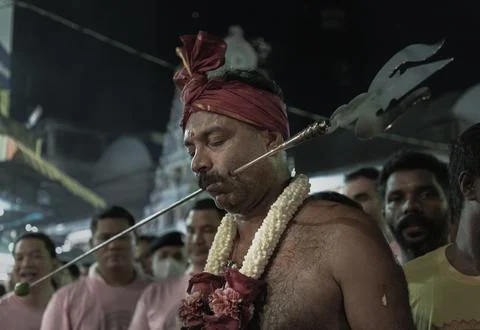 A devotee participating in a ritual during a Hindu festival. The ritual of .. Stock Photos