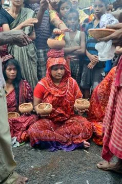 Devotee performing during shitala pujo vertical frame Stock Photos