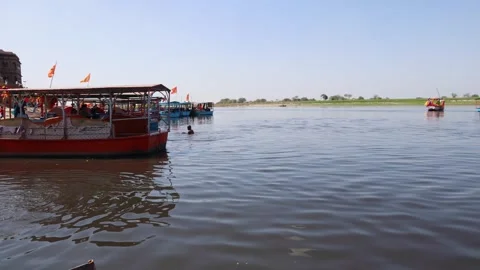 Devotee Performing Ritual Bath at Yamuna Riverbank in Vrindavan Stock Footage 340197544