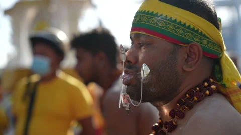 Devotee With Pierced Cheeks And Tongue During Penang Thaipusam Hindu Festival Stock Footage 234039748
