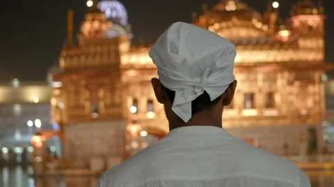 Devotee Praying in Front of Golden Temple  Spiritual Sikh Worship Scene Stock Footage 331341125