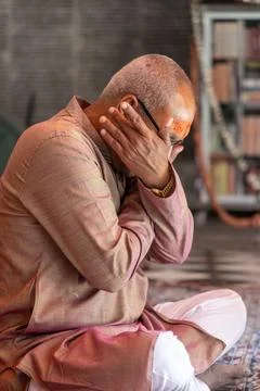 Devotee praying for holy god at temple at morning from flat angle Stock Photos
