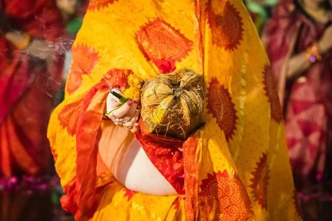 Devotee praying for sun god during Chhath festival from flat angle Stock Photos