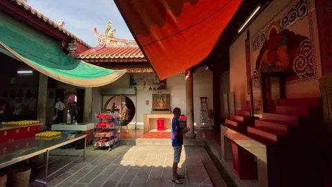 Devotee prays at the Goddess of Mercy temple, Penang, Malaysia 4K Stock Footage 261386054
