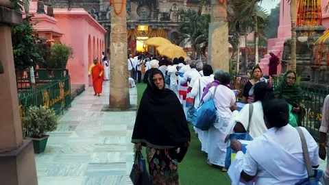 Devotee in queue with ancient traditional buddhist temple for morning pryers Stock Footage 169065589