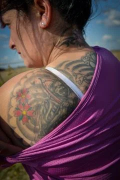 Devotee of Saint Death shows her tattoo Fotos de archivo