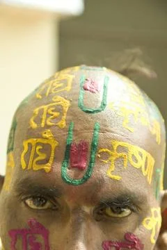 Devotee writing radhe krishna on head by sandalwood paste, uttar pradesh, ... Stock Photos