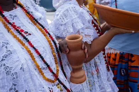 Devotees with beads and clay objects Stock Photos
