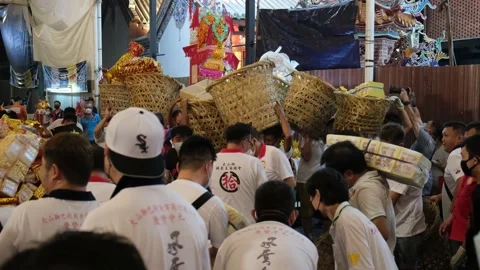 Devotees collect the offering joss paper... | Stock Video | Pond5
