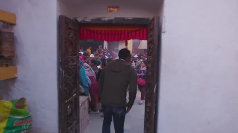 Devotees coming out from Boudhanath Temple Stock Footage 77482952