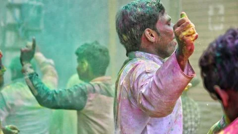 Devotees dancing to bid adieu to Lord Ganesha in Delhi during Ganesh Visarjan Stock Photos