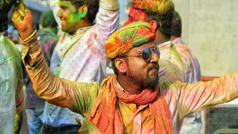 Devotees dancing to bid adieu to Lord Ganesha in Delhi during Ganesh Visarjan Stock Photos