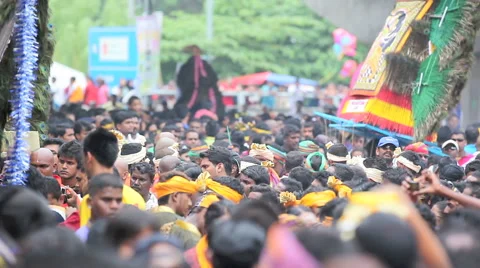 Devotees dancing with Kavadi in crowd at Thaipusam festival Stock Footage 41675650