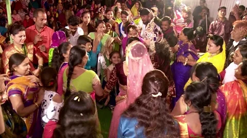 Devotee's dancing with Radha and Krishna in Maharaas Stock Footage 131097240