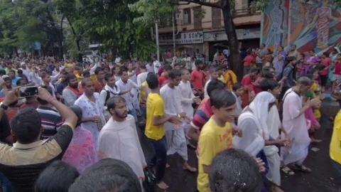 Devotees dancing a spiritual dance , on Rath yatra in Kolkata city Stock Footage 77192163