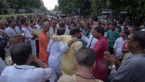 Devotees dancing a spiritual dance , on Rath yatra in Kolkata city Stock Footage 77192430