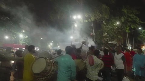 Devotees during the Hindu Goddess Durga immersion procession passing on street Stock-Footage 264021176