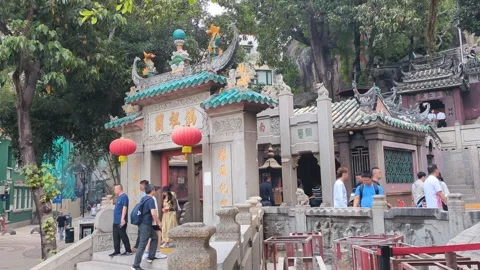 Devotees entering the world heritage old A-Ma temple in Macao Stock Footage 271629008