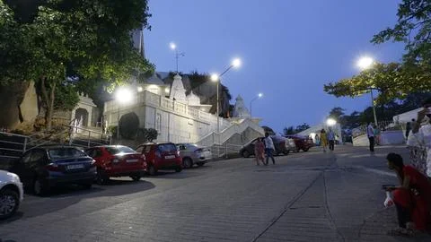 Devotees in front of Birla Mandir, Hindu temple in evening after sunset in .. Stock Photos