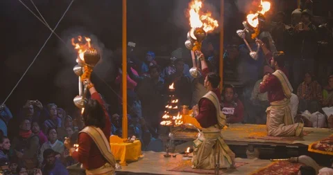 Devotees gathered and watching Ganges aarti prayers at sunset, India Stock Footage 113992195