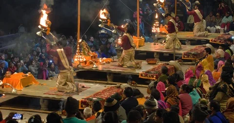 Devotees gathered and watching Ganges aarti prayers at sunset, India Stock Footage 113992508