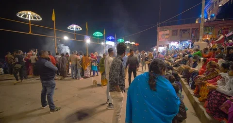Devotees gathered and watching Ganges aarti prayers at sunset, India Stock Footage 113992649