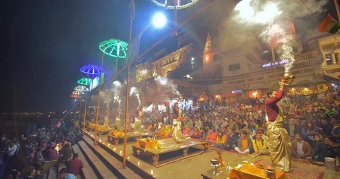 Devotees gathered and watching Ganges aarti prayers at sunset, India Stock Footage 113992934