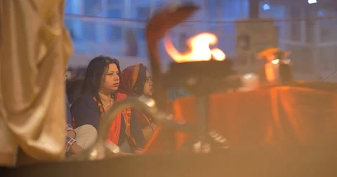 Devotees gathered and watching Ganges aarti prayers at sunset, India Stock Footage 113993879