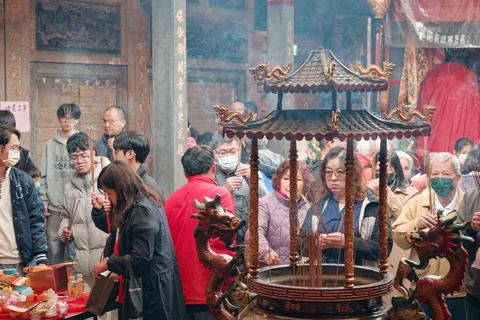 Devotees Gathered at Incense Cauldron During Lunar New Year 库存照片