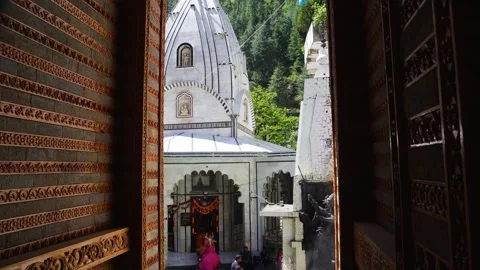 Devotees Gathering at Temple During Religious Worship Through an Intricately Stock Footage 346014493