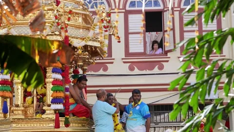 Devotees offering garlands during thaipusam near chariot procession Stock Footage 332736923