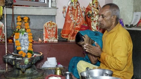 Devotees Offering Holy Prayers To Shiva Lingam During Hindu Temple Worship .. Stock Footage 338079681