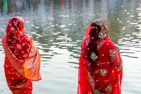 Devotees offering prayers to God During Chhath Puja Festival Stock Photos
