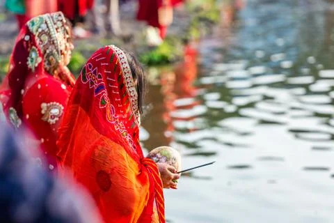 Devotees offering prayers to God During Chhath Puja Festival Stock Photos