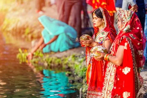 Devotees offering prayers to God During Chhath Puja Festival Stock Photos