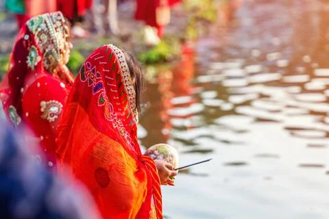 Devotees offering prayers to God During Chhath Puja Festival Stock Photos