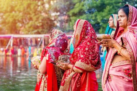 Devotees offering prayers to God During Chhath Puja Festival Stock Photos