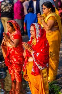 Devotees offering prayers to God During Chhath Puja Festival Stock Photos