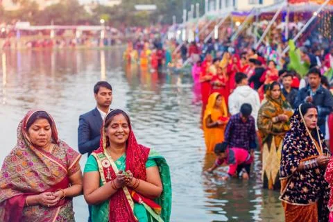 Devotees offering prayers to God During Chhath Puja Festival Stock Photos