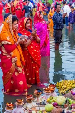 Devotees offering prayers to God During Chhath Puja Festival Stock Photos