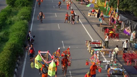Devotees Participating in Kawad Yatra in India Stock Footage 313548740